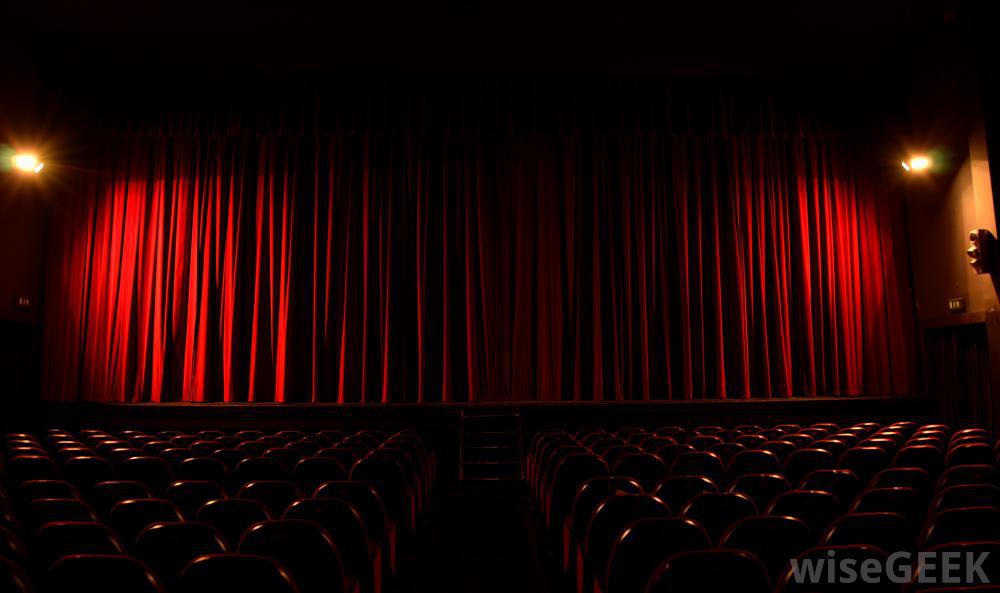 theater with red curtain and seats