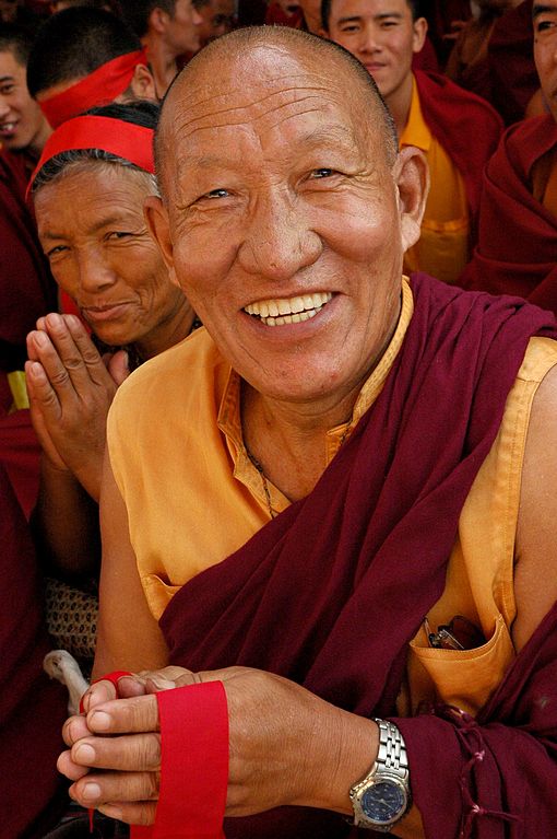 very_happy_tibetan_buddhist_monk