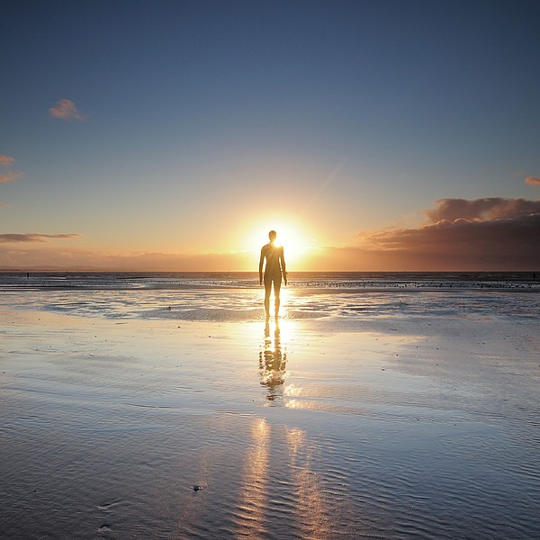 man-walking-on-beach