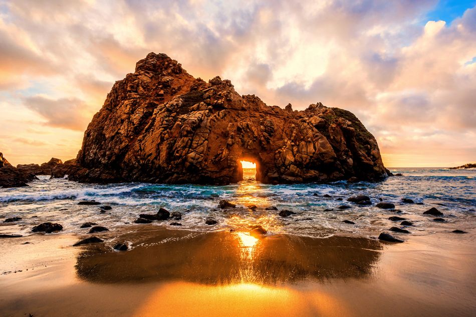sunset sea rock arch landscape