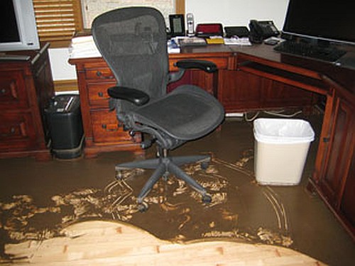 My muddy office floor after the floodwater came and went.