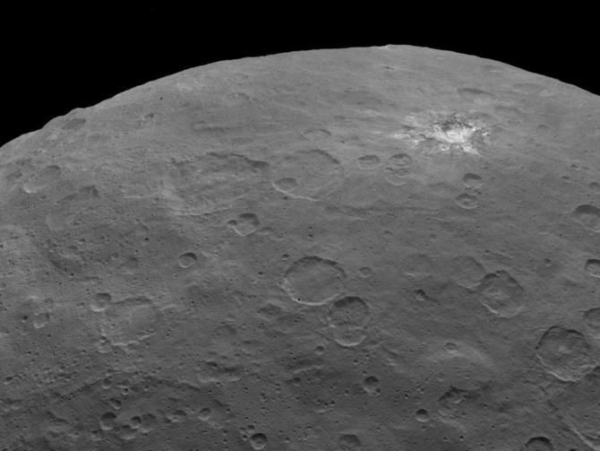 The reflective area around the crater in the top right of the image is what the Dawn team calls "spot 1. Credit: NASA/JPL-Caltech ceres