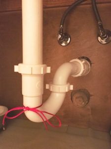 drain pipe red ribbon