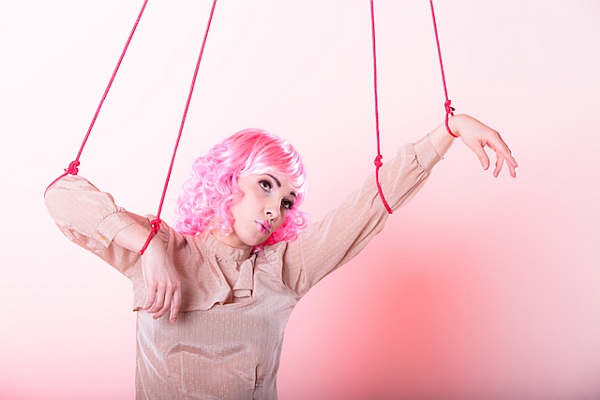 Stop Over-Depending on Others and Seeking Their Approval: How to Set Yourself Free woman with puppet strings